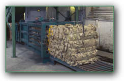 Bailer machine bundling cardboard for recycling